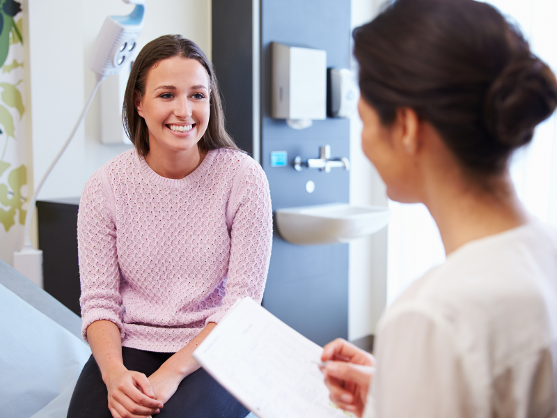 showing a healthcare conversation with two ladies on higher frequency level, smiling